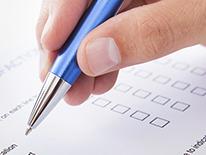 Photo of someone filling out a form